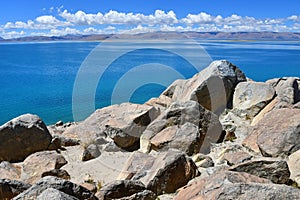 China. Great lakes of Tibet. Big stones of the store of the lake Teri Tashi Namtso in june