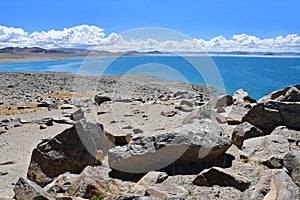 China. Great lakes of Tibet. Big stones of the store of the lake Teri Tashi Namtso in june