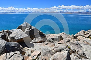 China. Great lakes of Tibet. Big stones of the store of the lake Teri Tashi Namtso in june