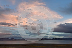 China. Great lakes of Tibet. Large clouds over lake Teri Tashi Namtso at sunset