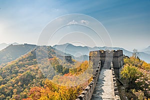 China The great wall distant view compressed towers and wall segments autumn season in mountains near Beijing ancient chinese for