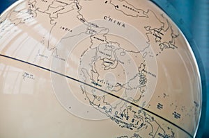 China India and South East Asia countries map in a retro old classic vintage Earth globe in executive management board room