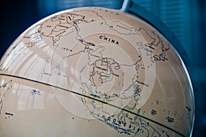 China India and South East Asia countries map in a retro old classic vintage Earth globe in executive management board room