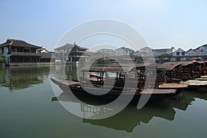 China ,Jinxi Water Village, Dark mat boats at Jinxi ancient Town