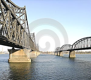 China - North Korea Friendship bridge left; and the Broken Bridge right, across the Yalu river.