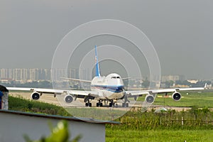 China Southern Airlines Boeing 747-41BF Taxiing On Runway Of Tan Son Nhat International Airport, Vietnam.
