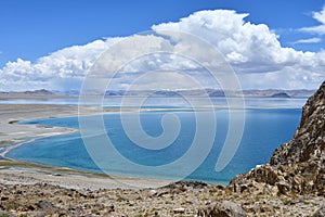 China, Tibet. Holy lake Tery Tashi Nam Co in summer cloudy day