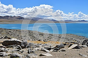 China, Tibet. The shore of lake Tery Tashi Nam Co in summer cloudy day