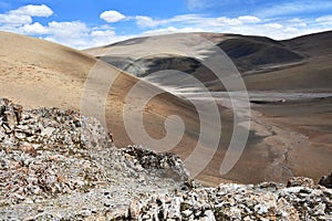 China, Tibetan Autonomous region. Summer mountain landscape 18 km from lake Gomang, the bed of a small mountain river