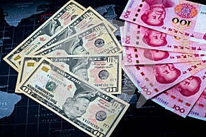 China-US trade war concept ,US dollar and Yuan banknotes