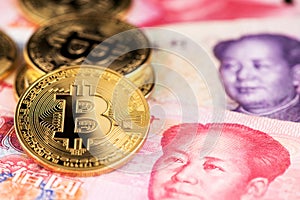 China Yuan Banknotes And Bitcoin Cryptocurrency Coins.