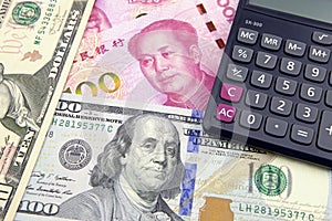 China Yuan and US dollar with a calculator