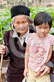 Chinas rural left-behind old man and child