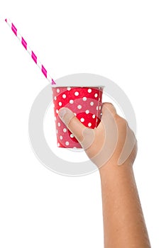 chinds hand holding red paper cup