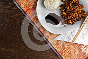 Chineese dish with rice and chicken top view photo