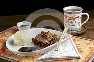 Chineese dish with tea and soy sauce arrangement