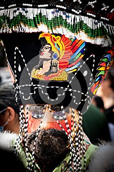 Chinelos are a traditional colorful costumed dancer in carnaval.