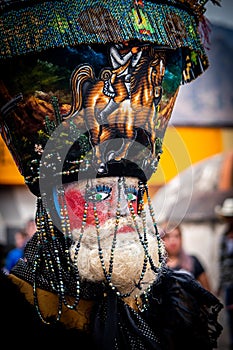Chinelos are a traditional colorful costumed dancer in mexican carnaval.