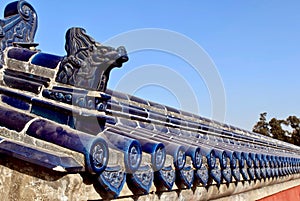 Chinese ancient ceramic blue roof tiles. traditional pattern with dragons. The temple roof against the blue sky. Temple of Heaven