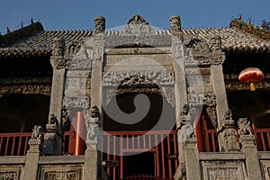 Chinese ancient stone decorated archway in Henan, China.