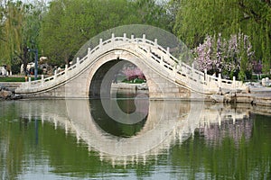 Chinese arch bridge in lake