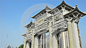 Chinese archway with stone carving zooming