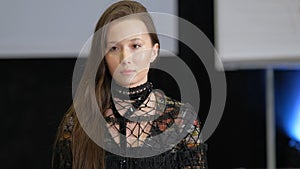 Chinese asian fashion model on catwalk podium. Female vogue defile on runway. photo