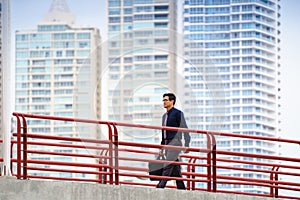 Chinese asian office worker walking commuting work