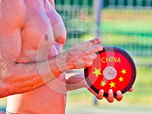 Chinese athlete preparing to throw the disc