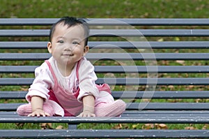 Chinese baby on the bench