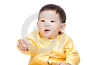 Chinese baby boy finger pointing toward