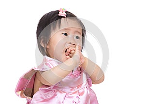 Chinese baby girl suck finger into mouth