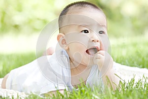 A Chinese baby on grass