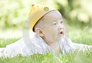 A Chinese baby on grass