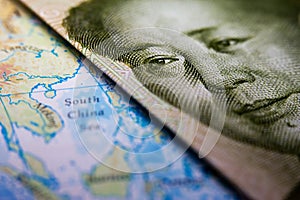 Chinese banknote and map South China Sea