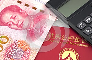 Chinese banknotes,calculator and housing accumulation fund bankbook on white background