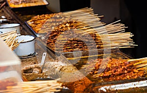 Chinese barbecue on sticks on a food market