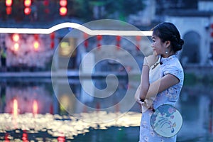 Chinese beauty in cheongsam enjoy free time