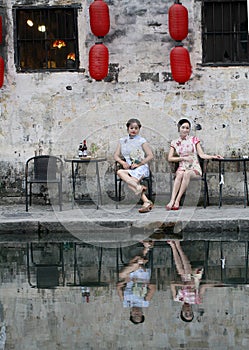 Chinese beauty girlfriends in cheongsam enjoy free time