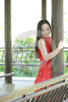 Chinese beauty relaxing in a park and enjoy her vactaion