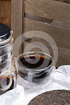 Chinese black pu-erh tea in a glass cup