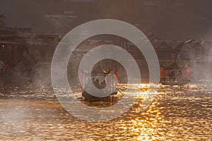 Chinese boat at Ban Rak Thai village in Mae Hong Son province, Thailand. Chinese characters on red lantern - Translated text means