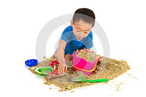 Chinese boy playing at the beach