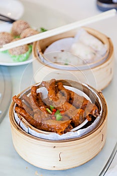 Chinese braised Chicken Feet Dim Sum in Bamboo Steamer