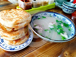 Chinese breakfast - lamb soup and clay oven rolls