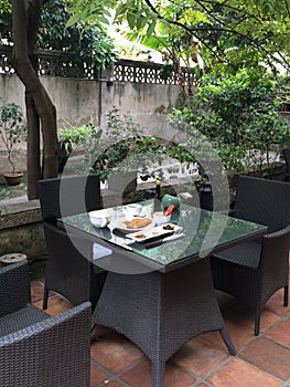 Chinese breakfast on a table in a hotel courtyard in Xiamen city, China