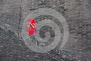 Chinese bride on an ancient city wall