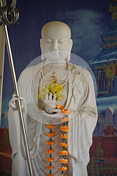 Chinese Buddha with titled trident image