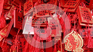Chinese Buddhist prayers on red plates photo