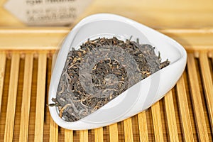Chinese bulk extruded tea ripe Pu Er in Tea presentation vessel
